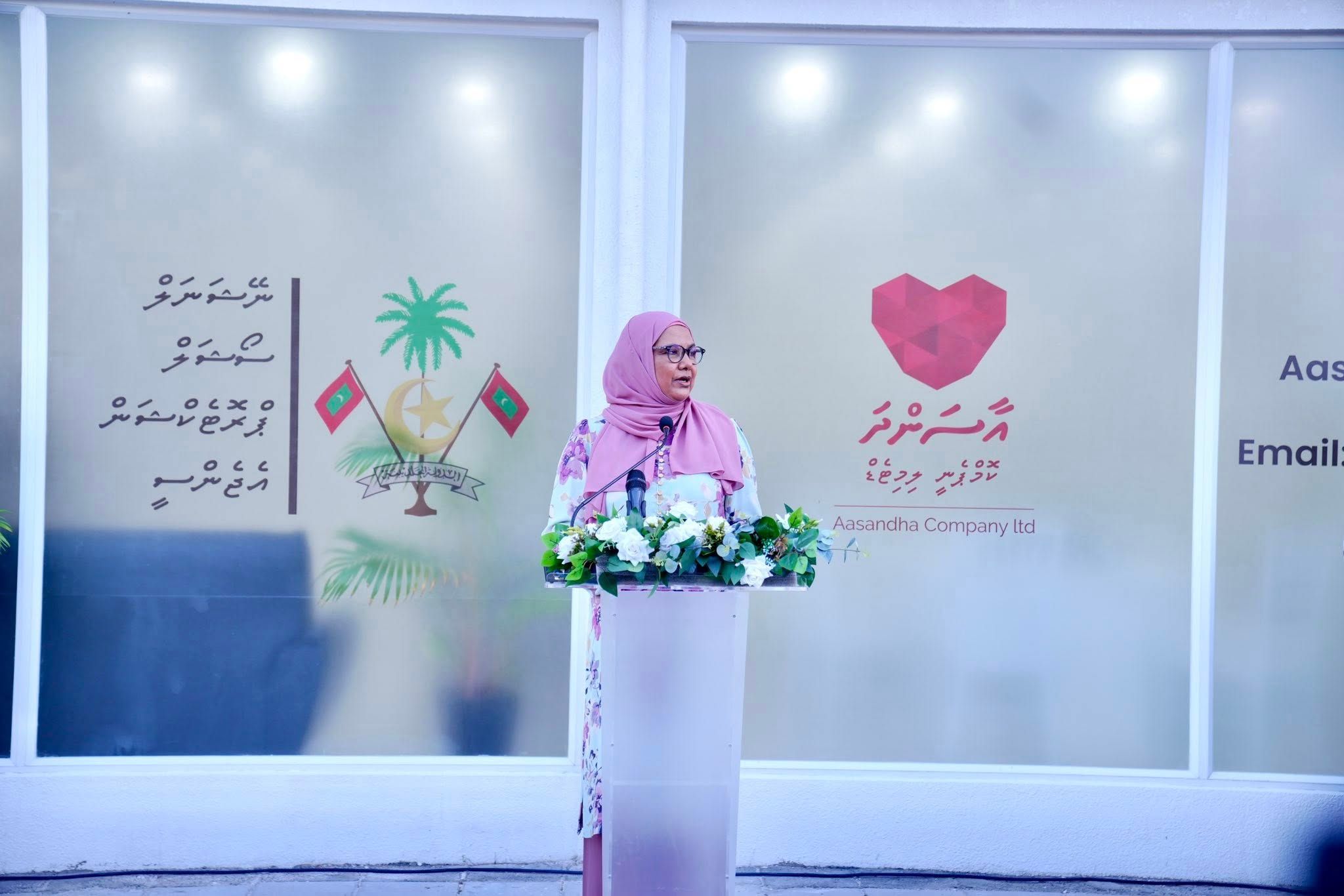 minister standing at a podium giving a speech during the Addu NSPA and Aasandha office opening ceremony